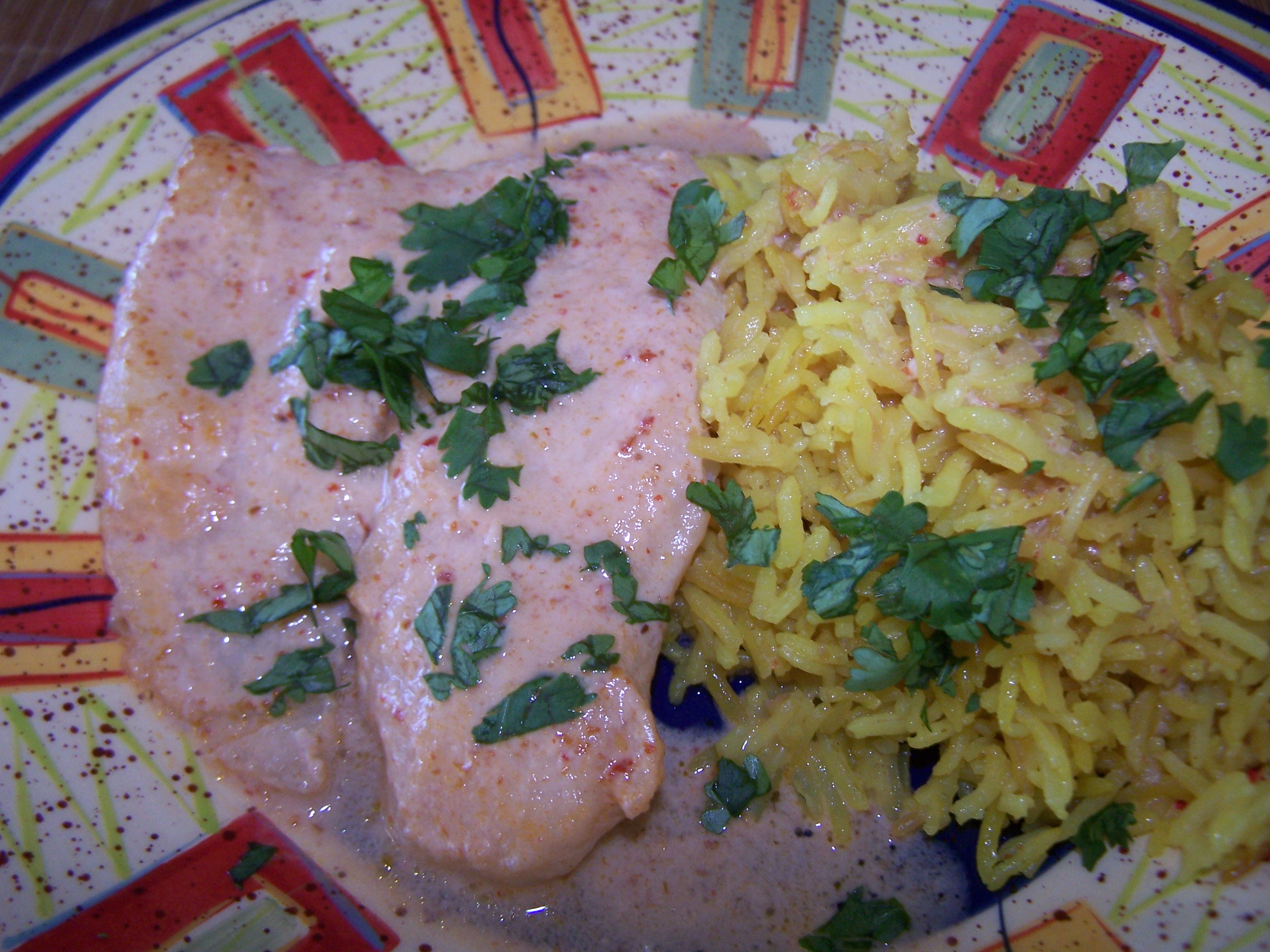 Tilapia in Red Curry Sauce with Turmeric Vermicelli Rice.